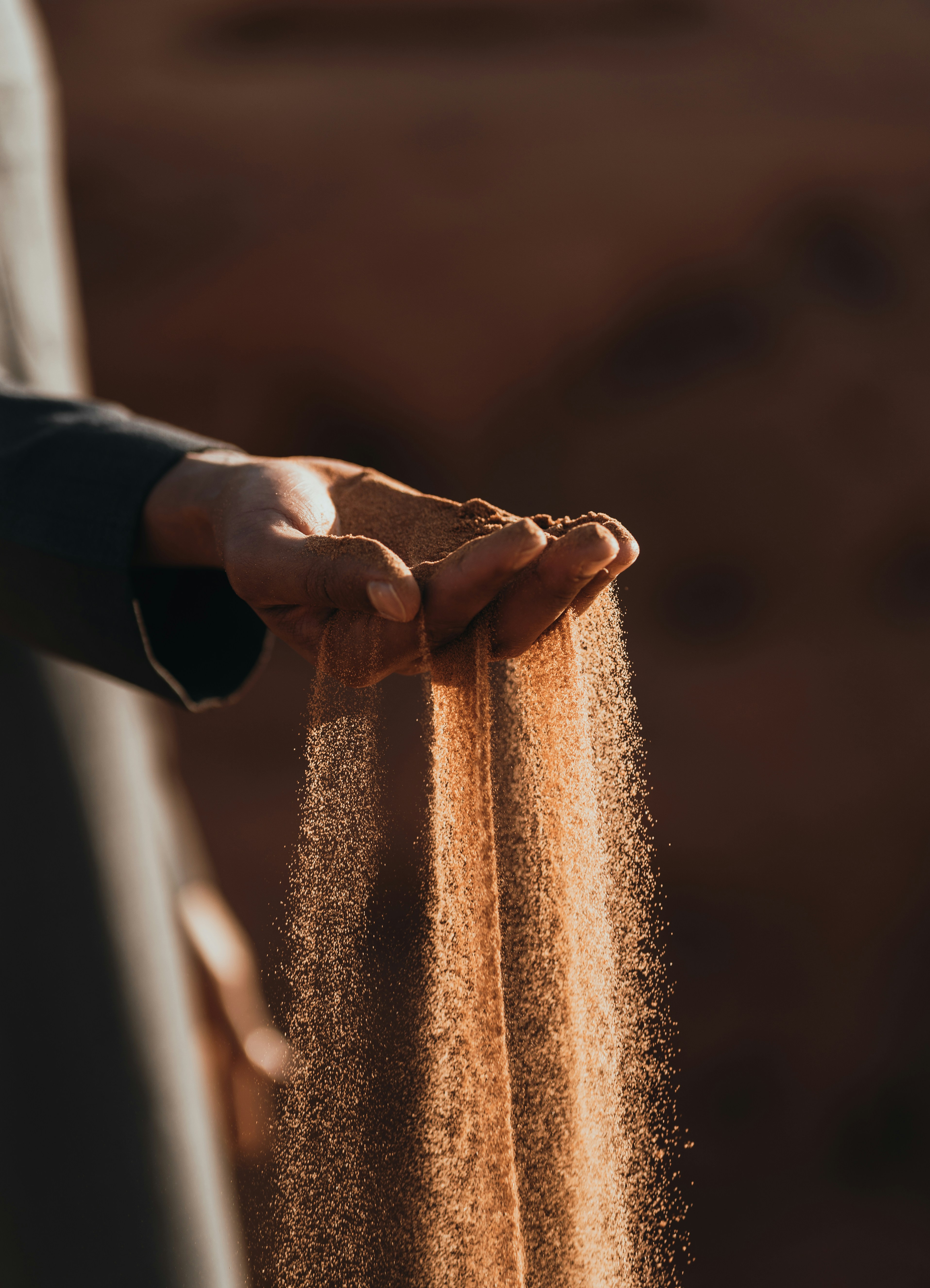 Hands holding sand
